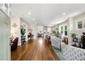Spacious living area with hardwood floors flows into an open-concept kitchen and dining area at 2026 S Lincoln St, Denver, CO 80210