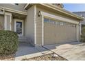 Close-up of garage, front entry and address of home at 9605 Elk Mountain Cir, Littleton, CO 80125