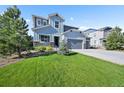Charming two-story home with a three-car garage and well-maintained lawn at 1665 Diamond Head Dr, Castle Rock, CO 80104