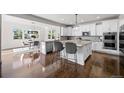 Beautiful kitchen boasts stainless appliances and a large center island at 1665 Diamond Head Dr, Castle Rock, CO 80104