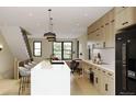 Modern kitchen with sleek cabinetry and large island at 4640 Tennyson St # 29, Denver, CO 80212