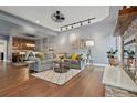 Open concept living room featuring hardwood floors, gray sofa and easy access to kitchen at 10000 E Yale Ave # 41, Denver, CO 80231
