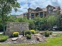 Chatfield Bluffs: Covenant controlled community, complete with well-manicured landscaping, a stone sign, and lovely trees at 8726 S Kline St # A204, Littleton, CO 80127
