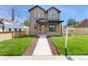 Charming two-story home featuring a manicured lawn, complemented by a welcoming walkway and a 'New Home' sign at 1970 S Logan St, Denver, CO 80210