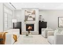 Modern living room featuring a fireplace and comfortable seating at 105 Fillmore St # 204, Denver, CO 80206