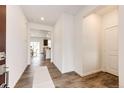 Bright entryway features wood floors, neutral walls, and ample natural light at 947 W Beverly St, Elizabeth, CO 80107