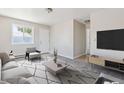 Comfortable living room with modern furnishings and large windows at 2340 Geneva, Aurora, CO 80010