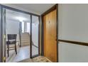 Apartment entryway features stairs and dark trim at 1611 Garfield Ave # 2, Louisville, CO 80027
