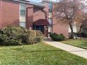 Brick building exterior with landscaping and walkway at 320 S Ames St # 5, Lakewood, CO 80226