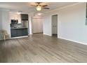 Open concept living room with new flooring and updated kitchen at 320 S Ames St # 5, Lakewood, CO 80226