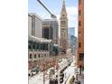 Urban street view featuring a clock tower and surrounding buildings on a sunny day at 1551 Larimer St # 1405, Denver, CO 80202