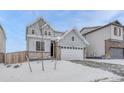 Charming two-story home with a two-car garage and appealing gray exterior at 13353 Amber Sky St, Parker, CO 80134