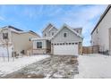 Charming two-story home with a two-car garage and appealing gray exterior at 13353 Amber Sky St, Parker, CO 80134