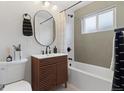 Charming bathroom with a modern vanity, tub, and stylish fixtures at 3377 N Krameria St, Denver, CO 80207