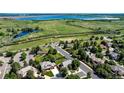 A quiet residential street with mature trees, well-maintained homes, and manicured lawns at 10293 E Sheri Ln, Englewood, CO 80111