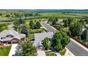 Charming home with mature trees, lush landscaping, and well-maintained lawns in a friendly neighborhood at 10293 E Sheri Ln, Englewood, CO 80111