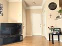 Bright and spacious entry foyer featuring hardwood floors, neutral walls, and multiple doors leading to different rooms at 1659 Harris St, Superior, CO 80027
