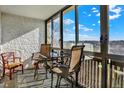 Enclosed patio area with comfortable seating, perfect for enjoying the outdoors at 7040 E Girard Ave # 406, Denver, CO 80224