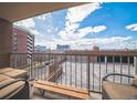 Relaxing outdoor balcony featuring seating and city views at 1301 Speer Blvd # 309, Denver, CO 80204