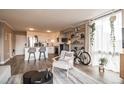 Inviting living space open to the kitchen, featuring modern furnishings and natural light at 1301 Speer Blvd # 309, Denver, CO 80204