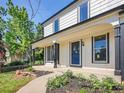 Charming home exterior with inviting front porch, manicured lawn, and attractive landscaping at 655 Gooseberry Ct, Lafayette, CO 80026