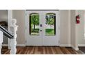 Bright entryway featuring double doors with views of the lush front yard at 10978 Roseanna Dr, Northglenn, CO 80234