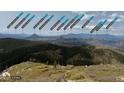 A scenic view of Colorado mountains with peak labels, providing an incredible landscape perspective at 14440 Eagle Vista Dr, Littleton, CO 80127