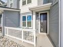 Beautifully designed home with porch and stone landscaping providing curb appeal at 2059 S Vance Way, Denver, CO 80227