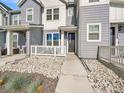 Inviting front entrance with a charming, cozy porch and stone landscaping at 2059 S Vance Way, Denver, CO 80227