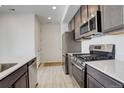 Modern kitchen with stainless steel appliances and ample cabinet space at 24501 E 41St Ave, Aurora, CO 80019