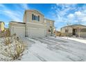 Two-story house with gray siding, attached garage, and snowy front yard at 533 Pioneer Ct, Fort Lupton, CO 80621