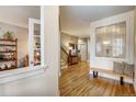 Bright and spacious entryway with hardwood floors and stained-glass window at 2059 S Columbine St, Denver, CO 80210