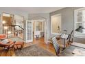 Home office with hardwood floors, built-in shelving and access to other rooms at 2059 S Columbine St, Denver, CO 80210