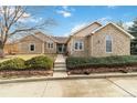 Attractive home with stone accents, manicured landscaping, and a walkway leading to the front entrance at 1133 Northridge Dr, Erie, CO 80516