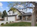 Inviting two-story home featuring a three-car garage, brick accents, and a cozy front porch at 20650 Parker Vista Cir, Parker, CO 80138