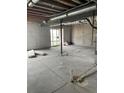 Unfinished basement with concrete floors and walls, offering potential for a customized living space at 6709 Juniper Dr, Thornton, CO 80602