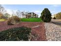 Landscaped front yard with rockery and manicured lawn at 9965 E 143Rd Way, Brighton, CO 80602