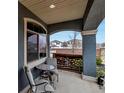 Cozy front porch featuring comfortable seating with views of the neighborhood at 5519 Genoa St, Denver, CO 80249