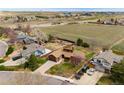 Aerial view of the property showcasing the house, surrounding neighborhood, large lot, and proximity to open space at 11875 W 107Th Ave, Broomfield, CO 80021