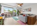 Stylish living room featuring a comfortable gray couch and a charming outdoor balcony area at 1150 Vine St # 306, Denver, CO 80206