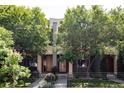 Contemporary home exterior with lush landscaping, a gated yard, and a welcoming entryway at 3130 Wyandot St, Denver, CO 80211