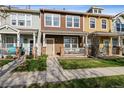 Charming townhome with a cozy front porch and manicured lawn at 15612 E 96Th Way # 13E, Commerce City, CO 80022