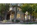 Charming two-story home featuring stone accents and beautiful trees in a residential neighborhood at 203 S Jackson St, Denver, CO 80209