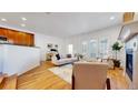 Cozy living room featuring hardwood floors, fireplace, and modern decor at 203 S Jackson St, Denver, CO 80209