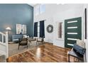 Bright living room with hardwood floors, high ceilings, and a modern aesthetic at 2182 S Zeno St, Aurora, CO 80013