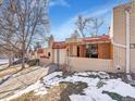 Ranch home with attached garage and covered entryway, viewed from the street at 2665 S Sheridan Ct, Lakewood, CO 80227