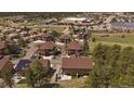 Bird's eye view of multiple homes, surrounded by lush greenery and blue sky at 726 Dreamcatcher Ln, Evergreen, CO 80439