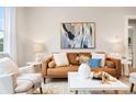 Cozy living room featuring modern furniture, soft lighting, and decorative artwork at 1805 W 51St Ave, Denver, CO 80221
