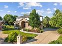 Beautiful two-story home boasts a brick facade, lush lawn, mature landscaping, and a welcoming entrance at 5284 Taft Ct, Arvada, CO 80002