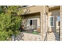 A cozy balcony with stone accents featuring a table and chairs at 11250 Florence St # 5C, Commerce City, CO 80640